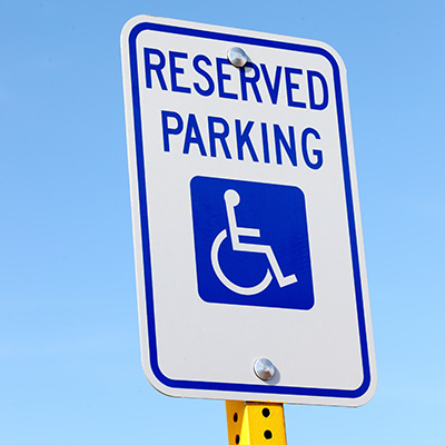 Accessible parking sign with the words Reserved Parking